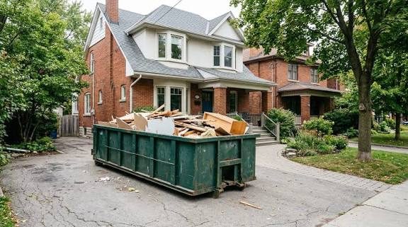 Green roll-off dumpster loaded with home renovation lumber in Laughlin, Nevada